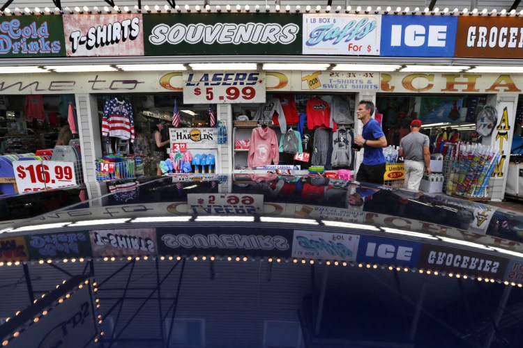 A souvenir shop attracts tourists in Old Orchard Beach. Canadians may be angry about President Trump's insults and tariffs, but it doesn't seem to be taking a toll on tourism. In Old Orchard Beach, popular with Canadians from Quebec, innkeepers report that tourism remains strong.