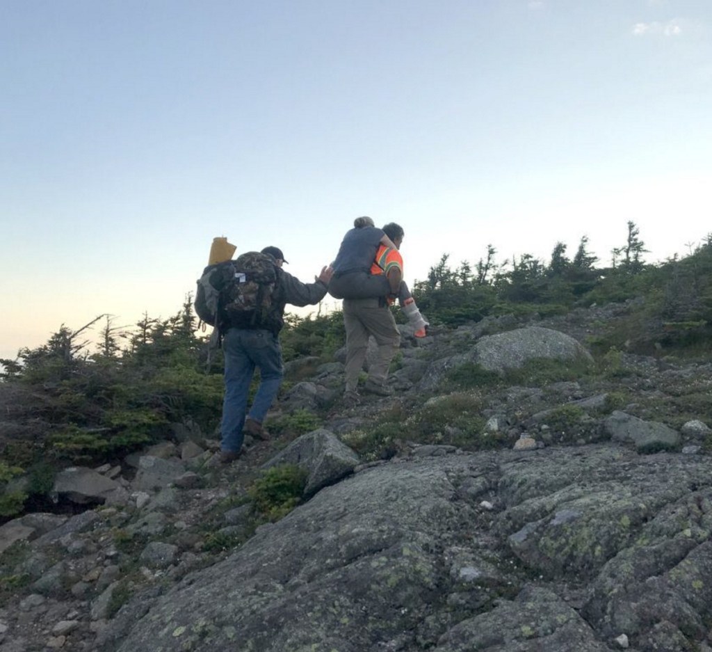 Emergency responders rescue Jennifer Custer early Friday after she broke her ankle on Bigelow Mountain in Wyman Township. Custer is being carried to the top of West Peak to meet a Maine Forest Service helicopter.