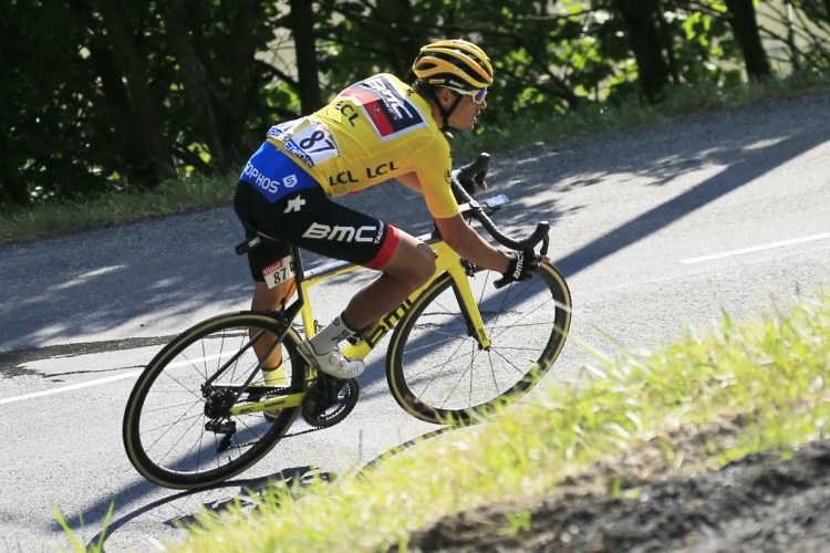 Belgium's Greg Van Avermaet, wearing the overall leader's yellow jersey, finished fourth in the first mountain stage of the Tour de France on Tuesday and stretched his lead to 2:22.