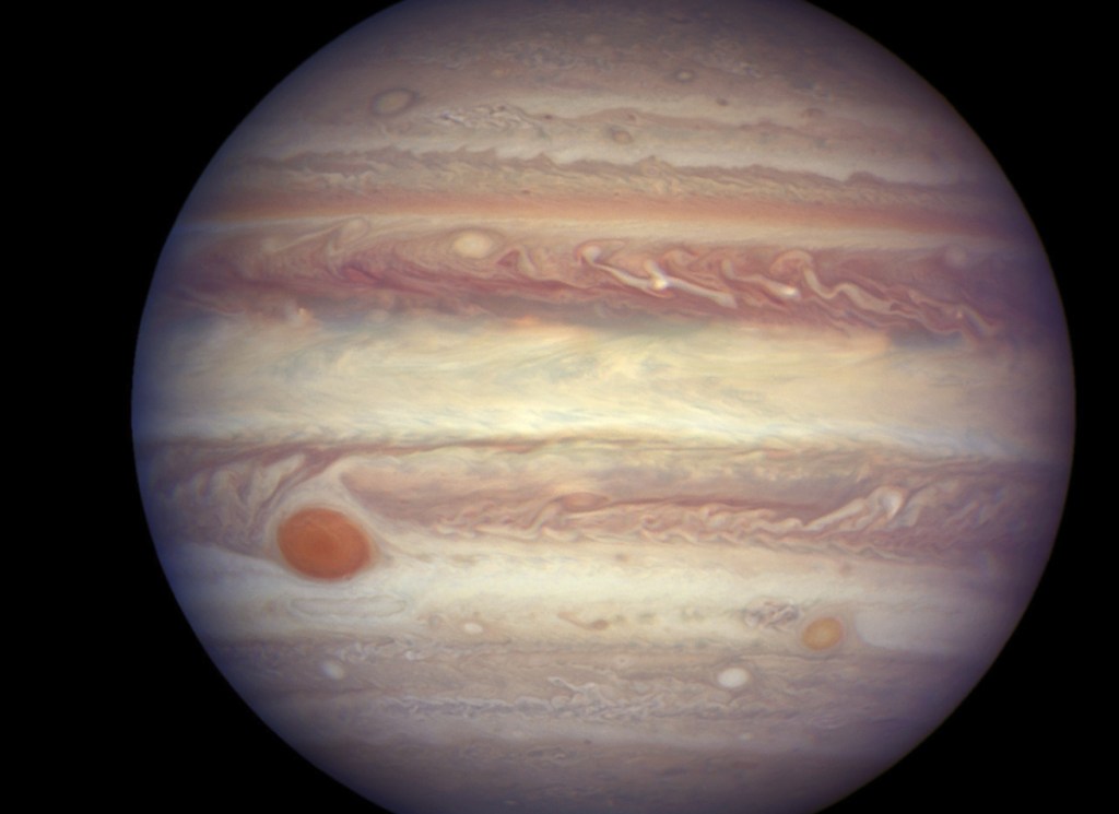 One of Jupiter's 12 new moons is being labeled an 'oddball' as it's circling in the same direction as the planet, opposite from the other 11.