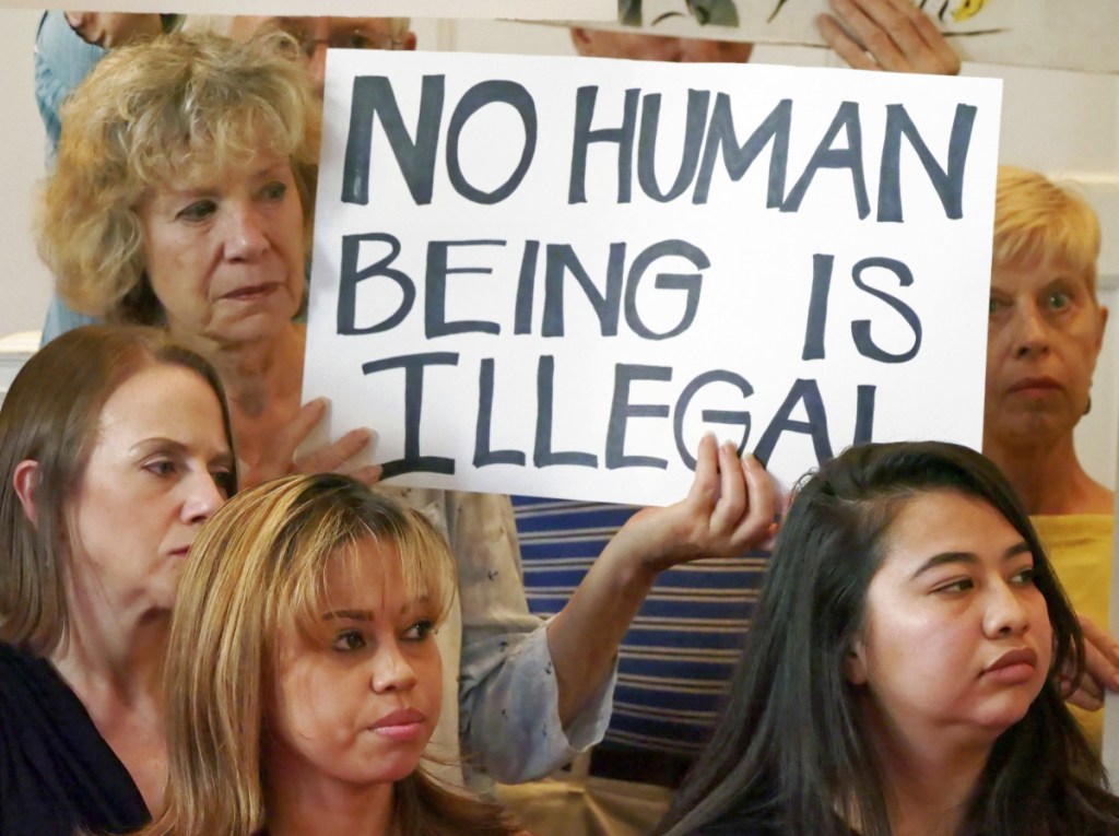 "Sanctuary city" supporters in Salt Lake City, at left, protest the government's immigration policies. New York state and city, Connecticut, New Jersey, Washington, Massachusetts and Virginia have filed lawsuits arguing that the government is unlawfully forcing sanctuary cities to cooperate with federal immigration enforcement.