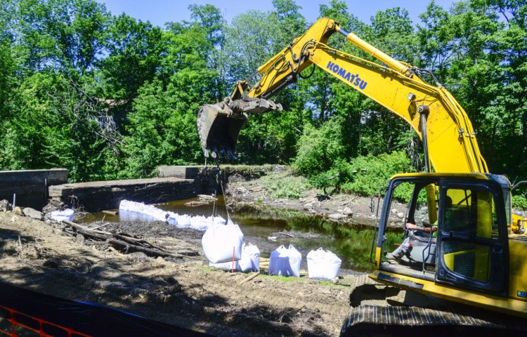 Crews begin demolition Thursday on the Coopers Mills dam on the Sheepscot River in Whitefield.