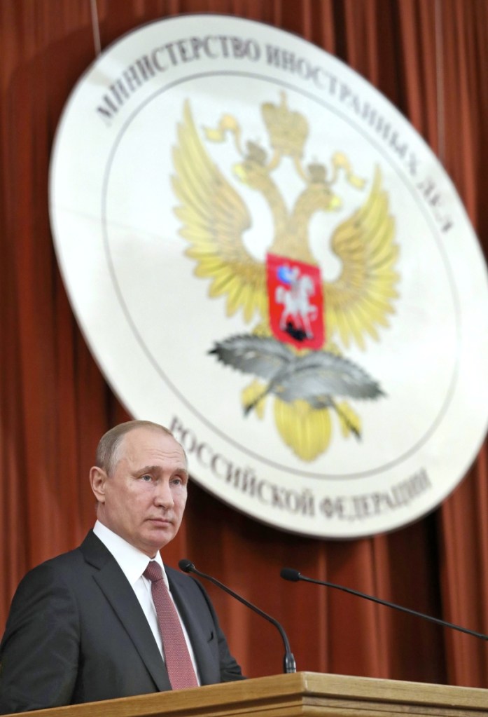 Russian Vladimir Putin speaks during a meeting with Russian ambassadors to foreign countries in Moscow, Russia, Thursday, July 19, 2018. Putin says his first summit with U.S. President Donald Trump was "successful" and is accusing Trump's opponents in the U.S. of hampering any progress on the issues they discussed. (Mikhail Klimentyev, Sputnik, Kremlin Pool Photo via AP)