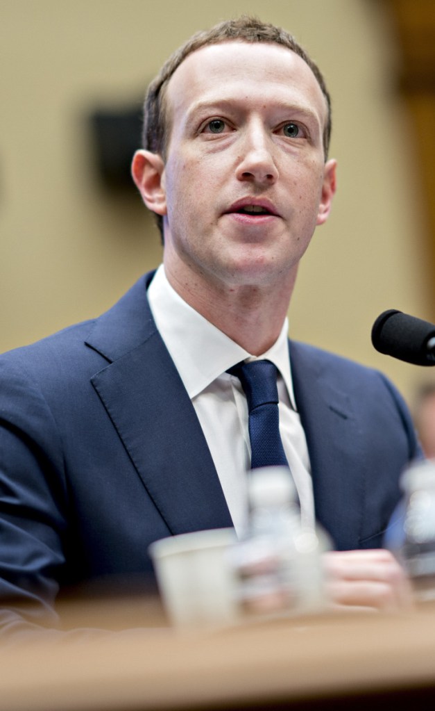 Mark Zuckerberg addresses lawmakers in April. Facebook is investigating how its user data is shared.