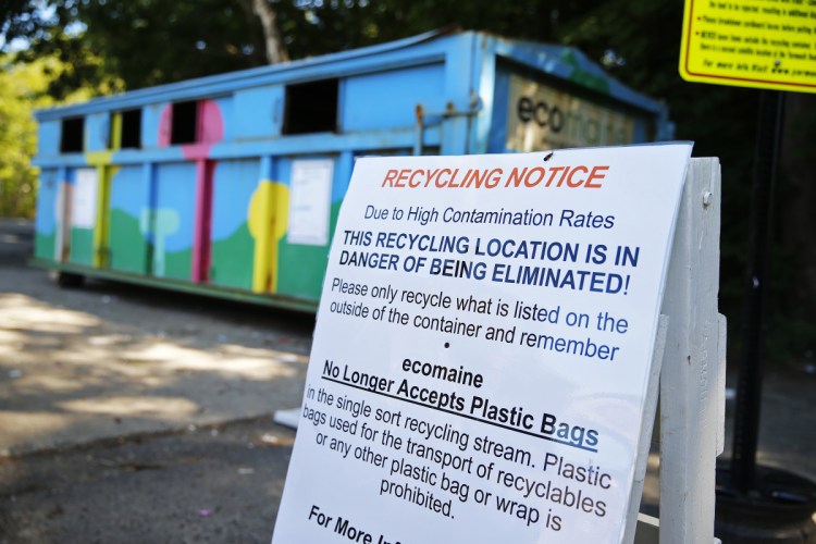 A sign posted by ecomaine in Yarmouth warns residents about the high contamination rates in the town's recycling, suggesting that this dropoff location could be in jeopardy of being eliminated.