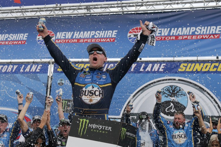 Kevin Harvick celebrates in Victory Lane after winning the NASCAR Cup Series race at New Hampshire Motor Speedway on Sunday in Loudon, N.H.
