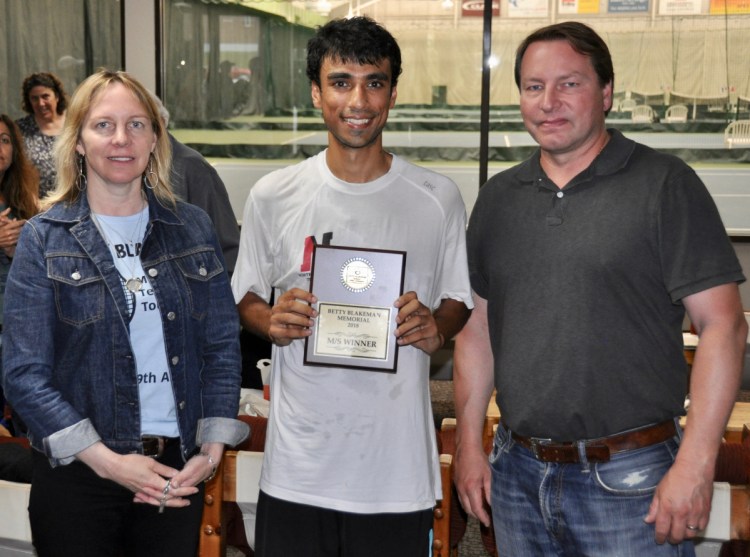 Unseeded Jai Aslam, pictured with tournament organizer Carrie Davenport, left, and Eric Blakeman, right, won the Betty Blakeman Memorial Tournament on Sunday.