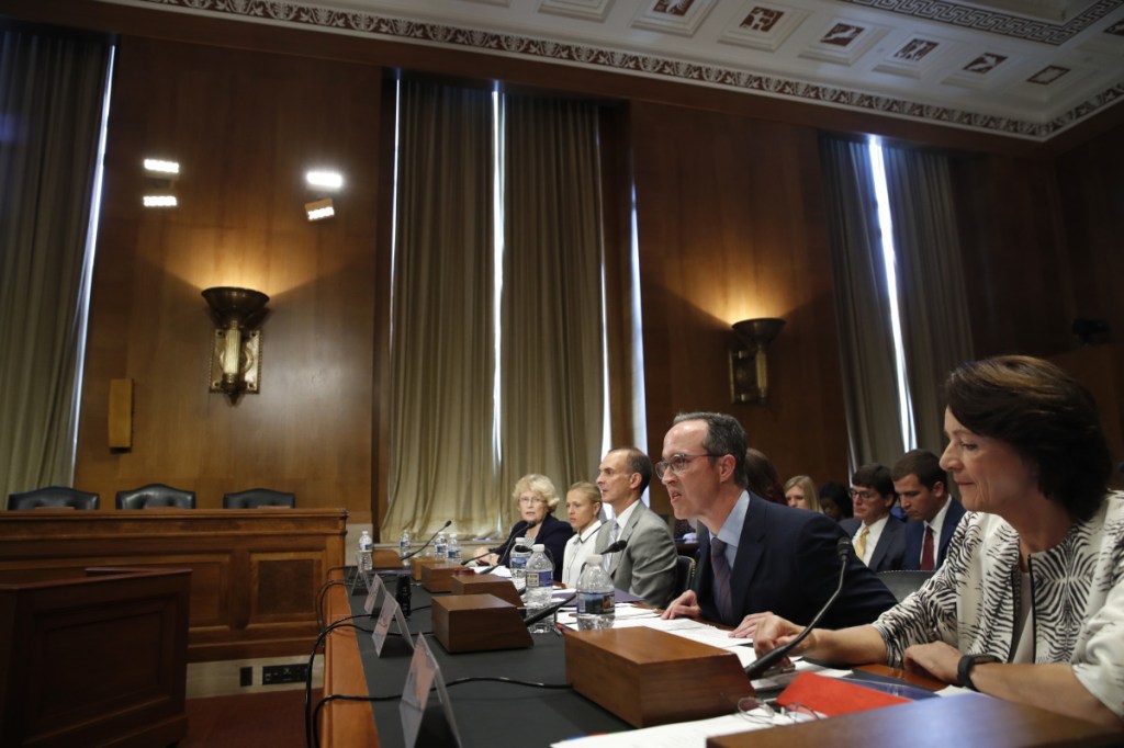 Jim Walden, second from right, the attorney for a Russian lab director who exposed cheating at the Sochi Olympics, testifies at a hearing on the impact of doping in international sport on Wednesday on Capitol Hill in Washington.