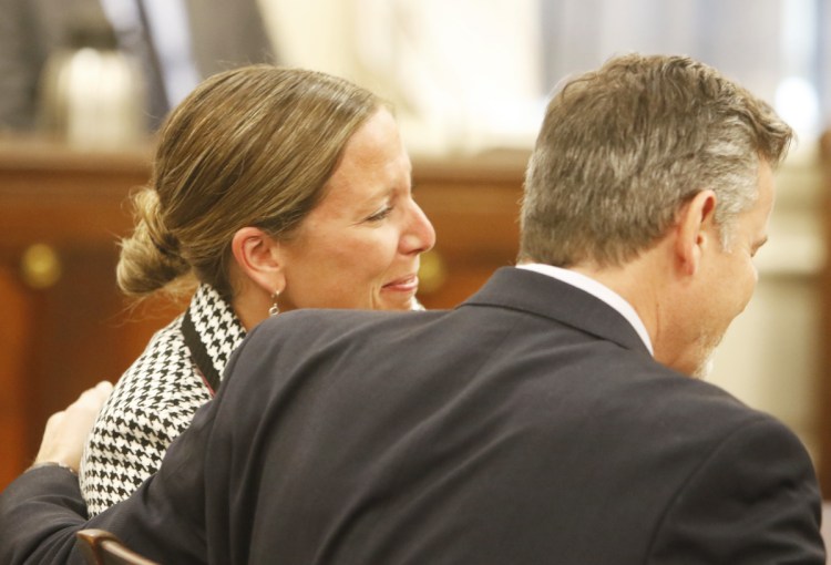 Jill Lamontagne, seated with her attorney, Scott Gardner, reacts as a jury finds her not guilty at York County Superior Court in Alfred on Thursday.