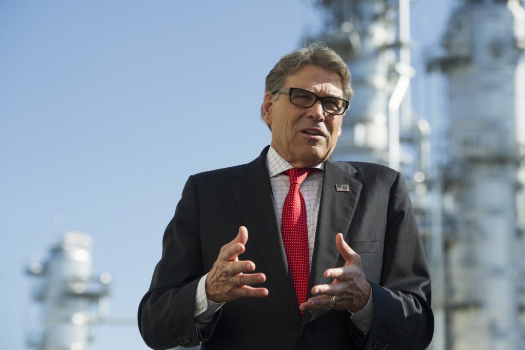 Secretary of Energy Rick Perry stands with the main cyrogenic heat exchange as he speaks with reporters at Dominion Energy's Cove Point LNG liquefaction Project facility in Lusby, Md., Thursday, July 26, 2018. The completion of the facilities export expansion project makes it just the second LNG export facility in the U.S. Associated Press/Cliff Owen