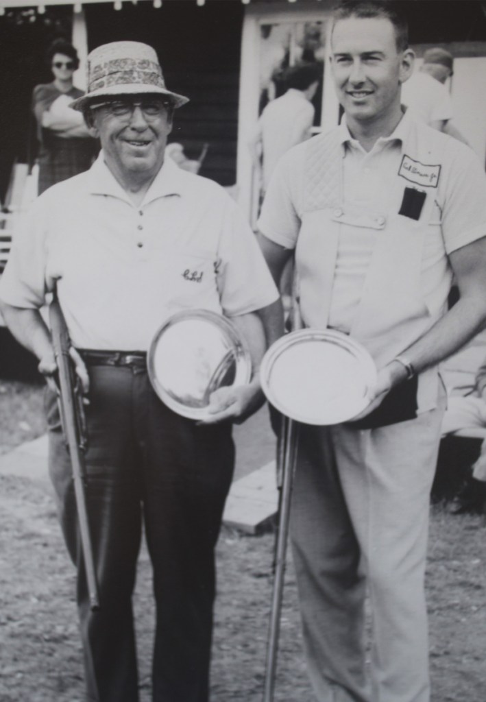 Cal Stinson Jr., right, and Cal Stinson Sr. pose with their prizes at a trapshooting competition in New Hampshire in 1960. The two competed side by side for years and are the only father-son inductees in the Maine Sports Hall of Fame.