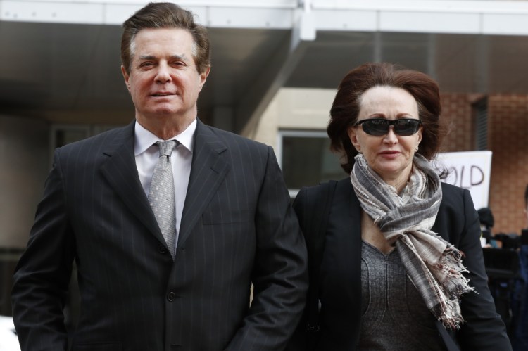 Paul Manafort, President Trump's former campaign chairman, arrives with this wife, Kathleen Manafort, at the federal courthouse in Alexandria, Va. in March. Manafort's trial on tax evasion and bank fraud charges began Tuesday.