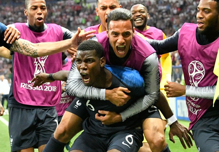 Paul Pogba, the Manchester United midfielder, carries a teammate in celebration Sunday after France won its first World Cup since 1998 and second overall by defeating Croatia 4-2 at Moscow. Pogba’s left-footed shot in the second half gave France a 3-1 lead.