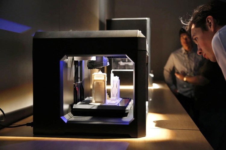 A MakerBot Industries 3-D printer is on display during the 2014 CES in Las Vegas. A 3-D printer can create a physical object out of a computer model. 