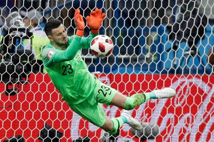 Croatia goalkeeper Danijel Subasic makes a save during a penalty shoot out after extra time during the round of 16 match between Croatia and Denmark on Sunday in Nizhny Novgorod, Russia.