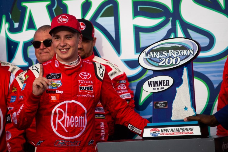 Christopher Bell stands next to the trophy after winning the NASCAR Xfinity Series race Saturday at New Hampshire Motor Speedway in Loudon, N.H.