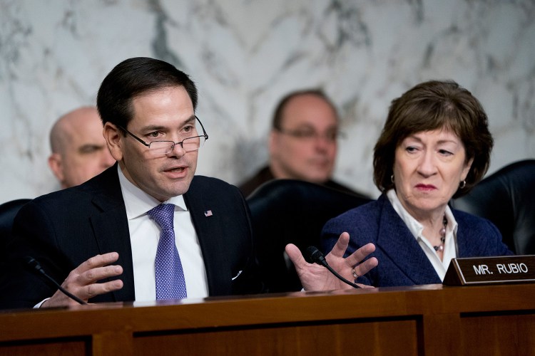 Sen. Susan Collins, R-Maine, is co-sponsoring a measure introduced by Sen. Marco Rubio, R-Fla., left, shown with her at a March meeting, and Sen. Chris Van Hollen, D-Md.  The bill would require tough sanctions within 10 days of a declaration by the director of national intelligence that Russia was interfering in an American political campaign. 