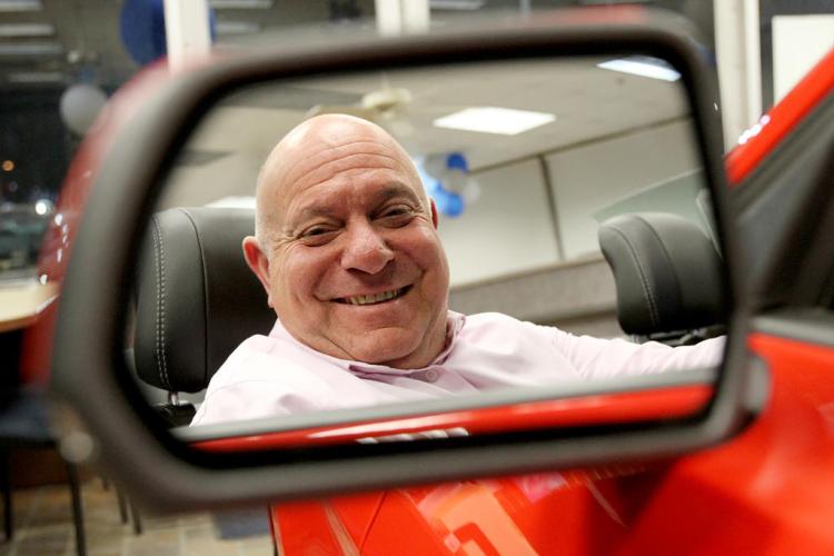 General Manager Bob Esposito behind the wheel at Yankee Ford in South Portland. Esposito is also managing partner of the dealership and two others in Brunswick and Rockland.