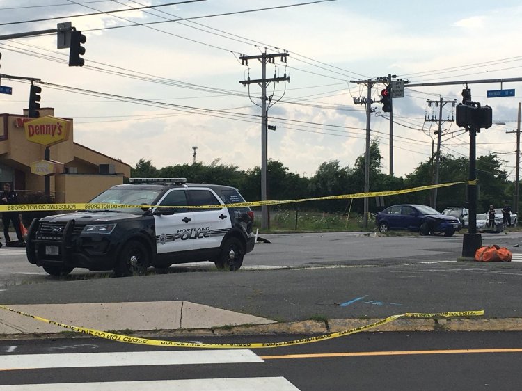 Portland police investigate the scene of a three-car crash where one person died at the junction of Riverside Street and Brighton Avenue on Saturday.