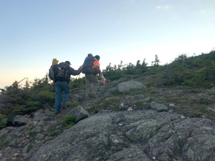 Emergency responders rescued Jennifer Custer, 38, of London, England, early Friday after she broke her ankle on Bigelow Mountain in Wyman Township. Custer is being carried up to the top of West Peak, which is 4,145 feet in elevation, to meet a Maine Forest Service helicopter. 