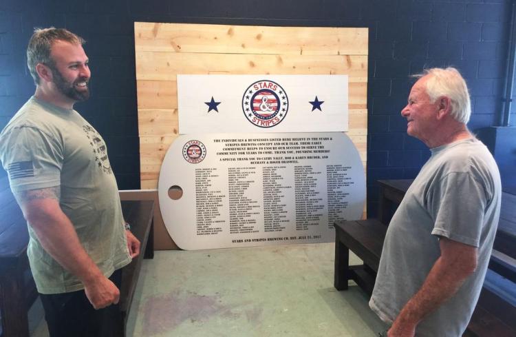Brad Nadeau has been aided in his efforts by friends such as Larry LaPointe of Gray, a Vietnam Army veteran. A plaque honoring those who have contributed to the project sits in the background, and will hang over the brewery's seating area.