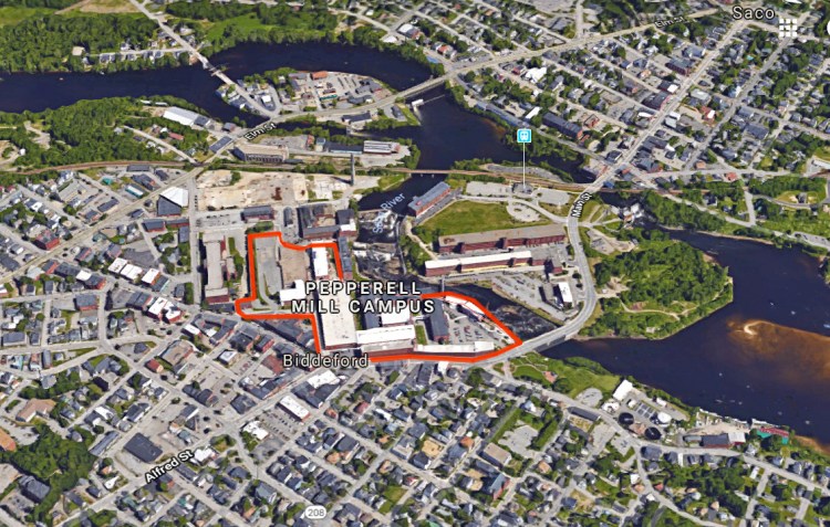 The Saco River flows past the former textile mills in Biddeford. The entire Pepperell Mill Campus, outlined here in red, includes 100 businesses.