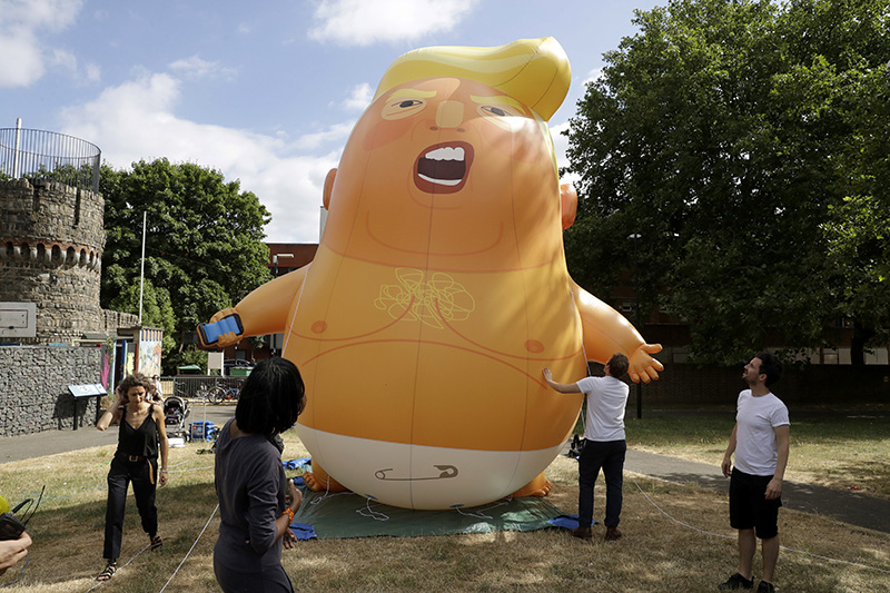 A six-meter high cartoon baby blimp of U.S. President Donald Trump depicting the president as an angry baby in a diaper will be flown from Parliament Square during what are expected to be massive gatherings of protesters opposed to Trump’s presence. 