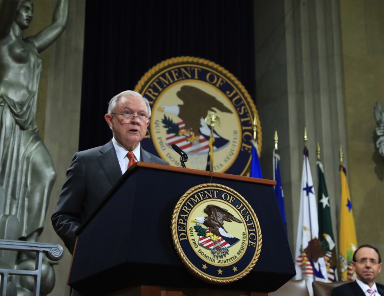 Attorney General Jeff Sessions speaks during a Religious Liberty Summit at the Department of Justice on Monday. Seated on the right is Deputy Attorney General Rod Rosenstein.
