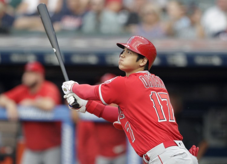 Shohei Ohtani of the Angels watches his two-run home run off Indians starter Mike Clevinger in the first inning Friday night. He added a solo shot in the third.