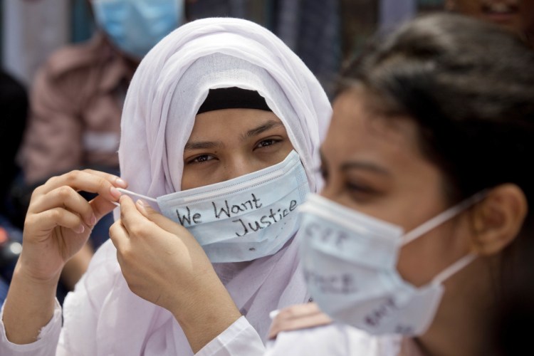 Bangladeshi students participate in a protest in Dhaka on Saturday. Five days of protests by tens of thousands of students angry over the traffic deaths of two of their peers have largely cut off the capital from the rest of the country. 