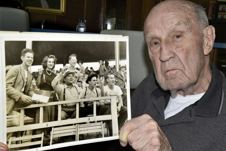 Don Eames, 91, of Norridgewock holds a photo that shows him, at bottom right, cheering during a horse race in the mid-1930s at the Skowhegan State Fairgrounds.