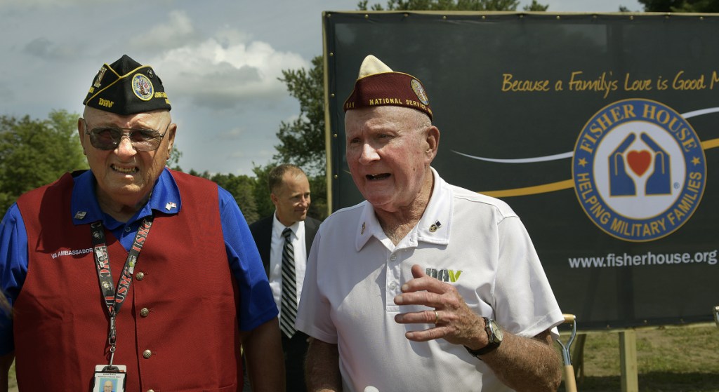 Vietnam War veterans Dennis Gagne, left, and Gary Burns speak with VA Togus Director Ryan Lilly at the groundbreaking Wednesday of the Fisher House. The facility will house veterans family members while they receive treatment at Togus.