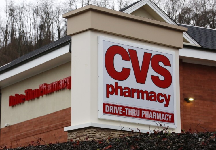 Drugstore and pharmacy benefits manager CVS did raise its annual profit forecast and rose 4.2 percent to $68.17 a share, with increased prescriptions sales a factor.