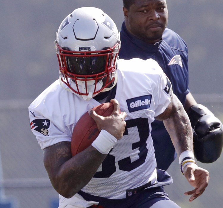 Running back Jeremy Hill, signed by the Patriots in the offseason, is one of many running backs competing for playing time in training camp.