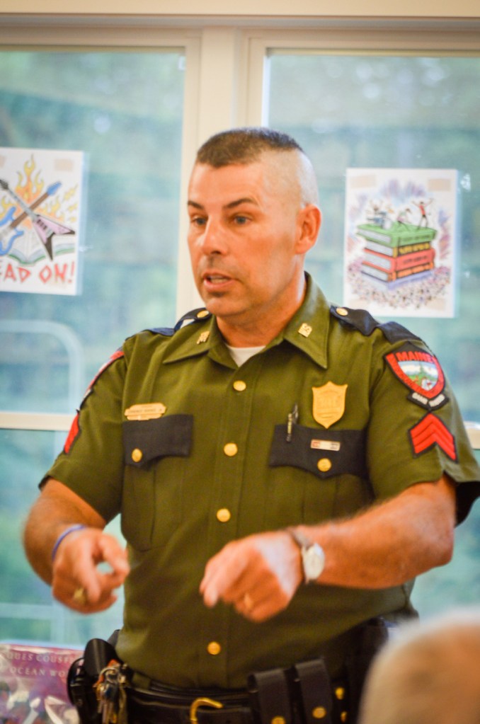 Maine game warden Sgt. Terry Hughes speaks on Wednesday at the Belgrade Public Library about the discovery and arrest of Christopher Knight, the North Pond Hermit.