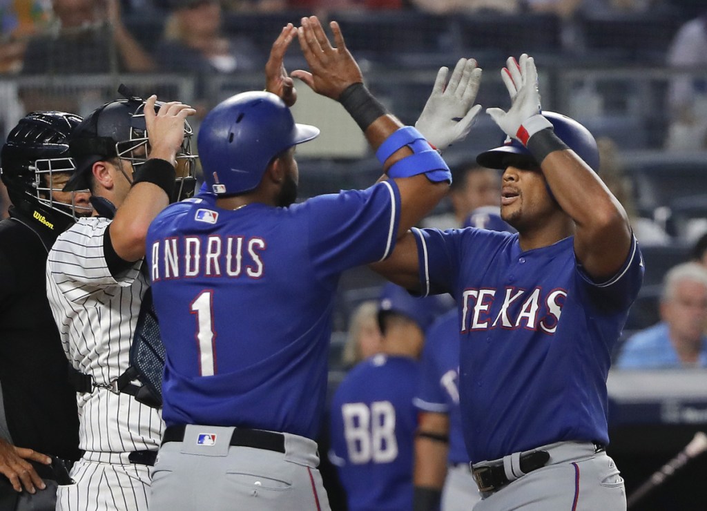 Texas Rangers' Adrian Beltre, right, is congratulated by Elvis Andrus (1) after hitting a two-run home run against the New York Yankees during the fourth inning of a baseball game Friday, Aug. 10, 2018, in New York. ()