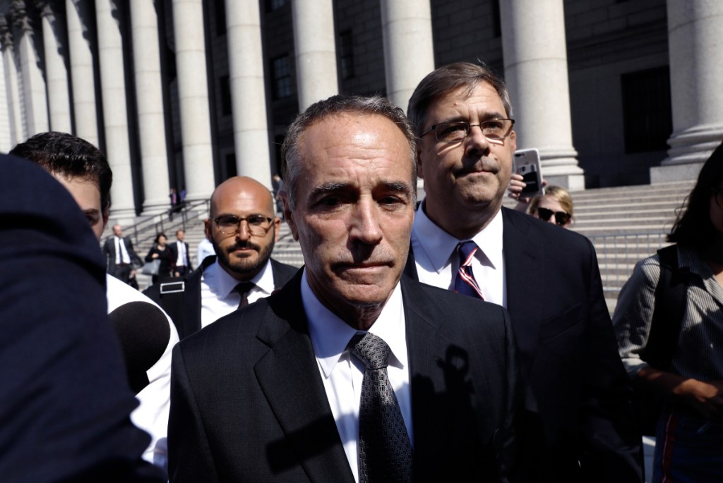 Bloomberg/Peter Foley 
 Rep. Christopher Collins, a Republican from New York, exits federal court in New York on Aug. 8, 2018.