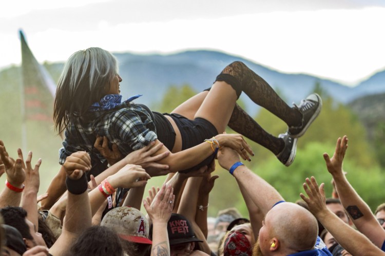 Crowd-surfing, as seen at the 2015 Knotfest USA in San Bernardino, Calif., often entails groping.