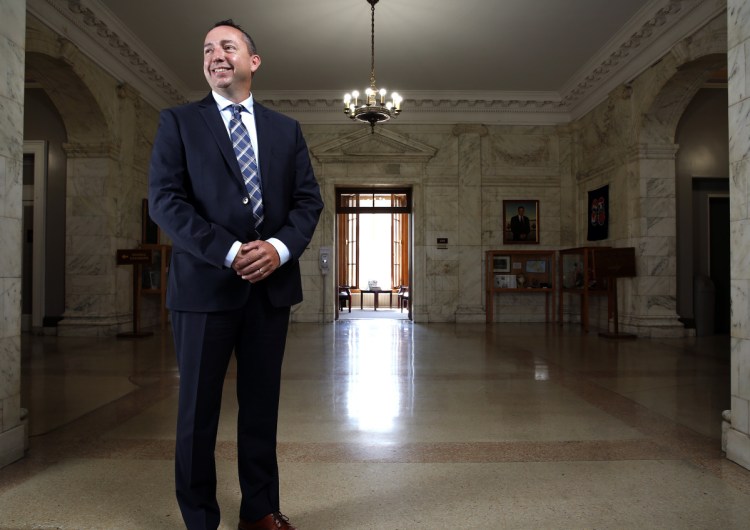 Former Portland Police Chief Michael Sauschuck poses Friday in his new workplace: Portland City Hall. Sauschuck is now an assistant city manager, hanging up his badge after a long career in law enforcement.