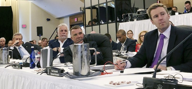 Massachusetts Gov. Charlie Baker, left, Quebec Premier Phillippe Couillard, Vermont Gov. Phil Scott and New Brunswick Premier Brian Gallan attend the Conference of New England Governors and Eastern Canadian Premiers.