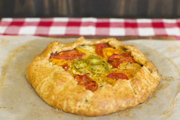 The Tomato and Corn Tart, an ode to summer, uses an easy-to-work-with cornmeal and cheese dough.