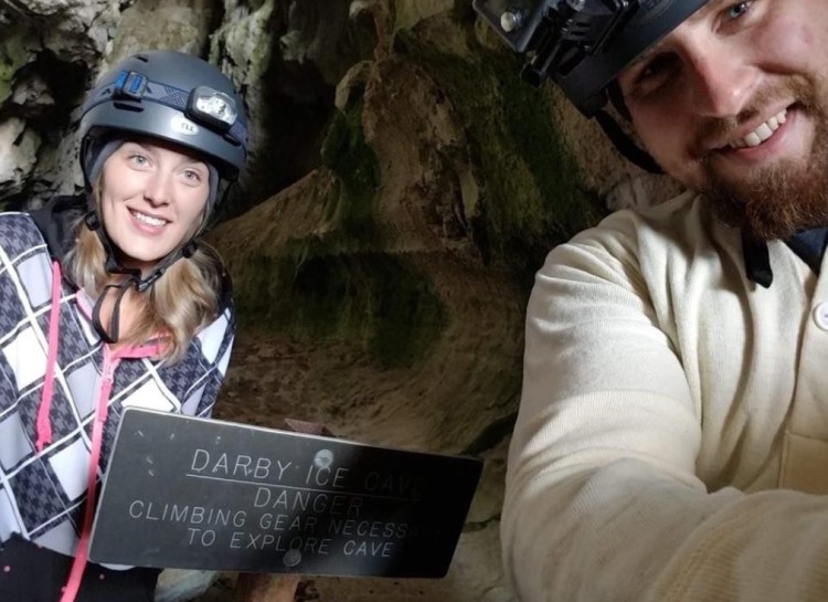 Jessica and Spencer Christiansen pose inside Darby Canyon Ice Cave on Aug. 11.