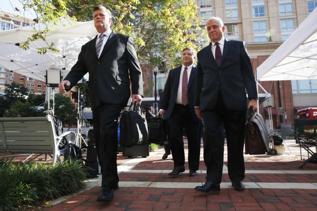 Members of the defense team for Paul Manafort, from left, Kevin Downing, Richard Westling and Thomas Zehnle, walk to federal court for closing arguments in the trial of the former Trump campaign chairman, in Alexandria, Va., on Wednesday.