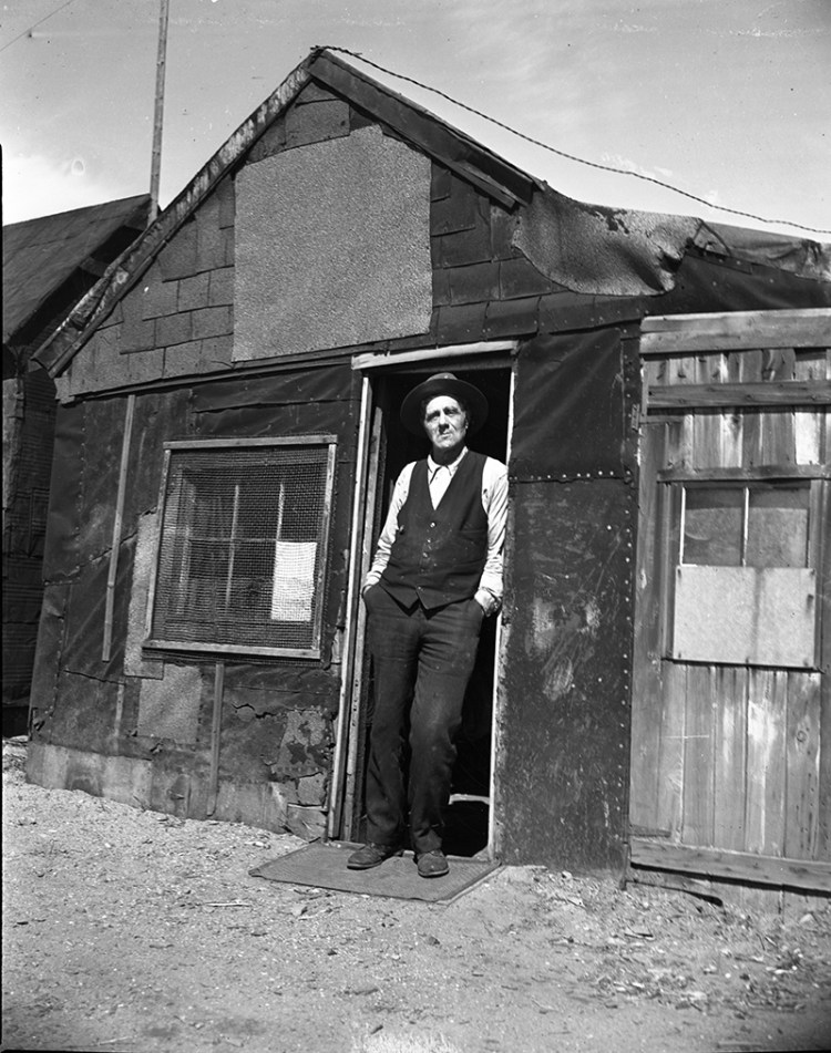 Bill Powers outside his Portland shack in 1938, after city councilors voted to raze the structure built on Back Cove. A reader takes issue with the caption that ran online referring to the "Back Bay."