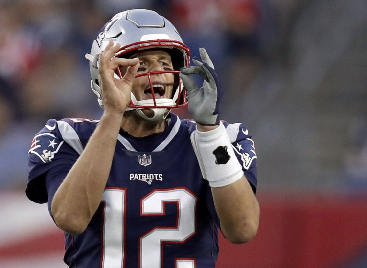 Patriots quarterback Tom Brady calls signals at the line of scrimmage during the first half Thursday night against the Philadelphia Eagles at Foxborough, Mass.