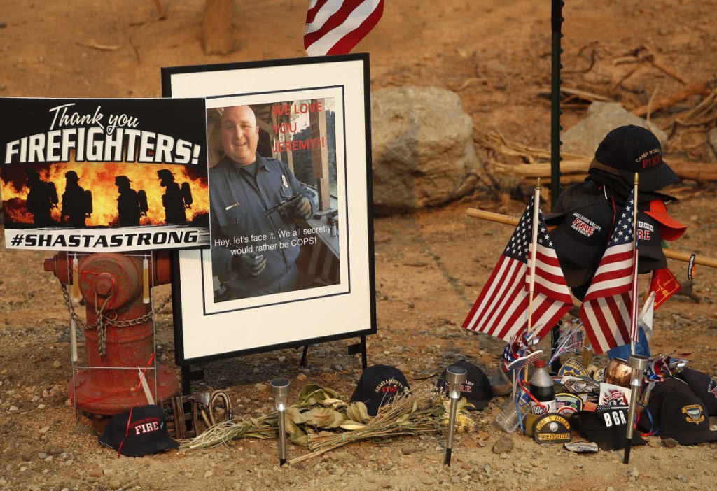 A memorial honors Jeremy Stoke of the Redding Fire Department in Redding, Calif. Stoke, 37, died July 26 when he was enveloped in seconds by a fire tornado with a base the size of three football fields and winds up to 165 mph.