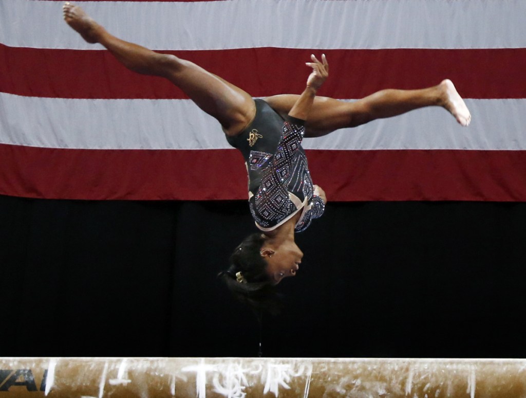 Simone Biles posted the best score in the balance beam as well as the other three events Friday on the first day of the women's competition at the U.S. Championships in Boston.