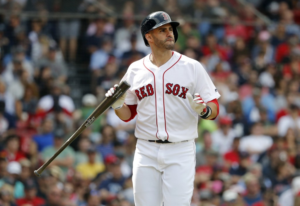 J.D. Martinez heads back to the dugout after striking out in the seventh inning Sunday against the Tampa Bay Rays. Martinez went 0 for 3, ending his streak of reaching base in 51 straight games at Fenway Park.