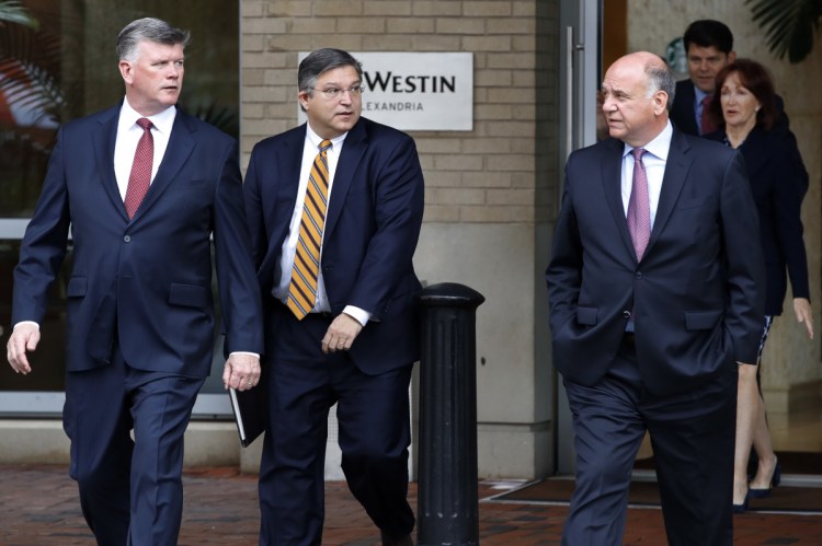 Kevin Downing, left, Richard Westling and Thomas Zehnle, members of the defense team for Paul Manafort, followed by Manafort's wife, Kathleen Manafort, right, and spokesman Jason Maloni, walk to federal court for continuing jury deliberations in the trial of the former Donald Trump campaign chairman, in Alexandria, Va., on Monday.