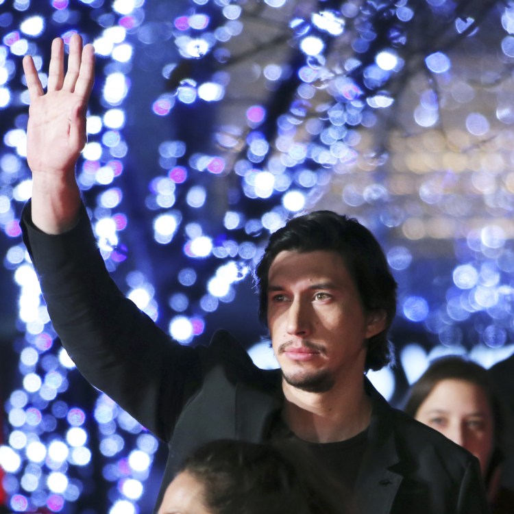 Adam Driver, who plays Kylo Ren in the "Star Wars" films, arrives at the Tokyo premiere of "Star Wars: The Force Awakens." He says he recalls Ku Klux Klan rallies as a child growing up in Mishawaka, Ind.